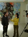 Yosi interviewing in front of David Choe