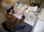 The assistant is inking the each animation drawing.