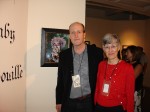 Mr. and Mrs. James Gurney in front of his painting at the Riverside Art Museum