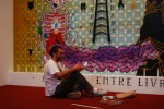 Viva La Revolucion Stephan Doitschinoff aka Calma puts the finishing touches on his installation.