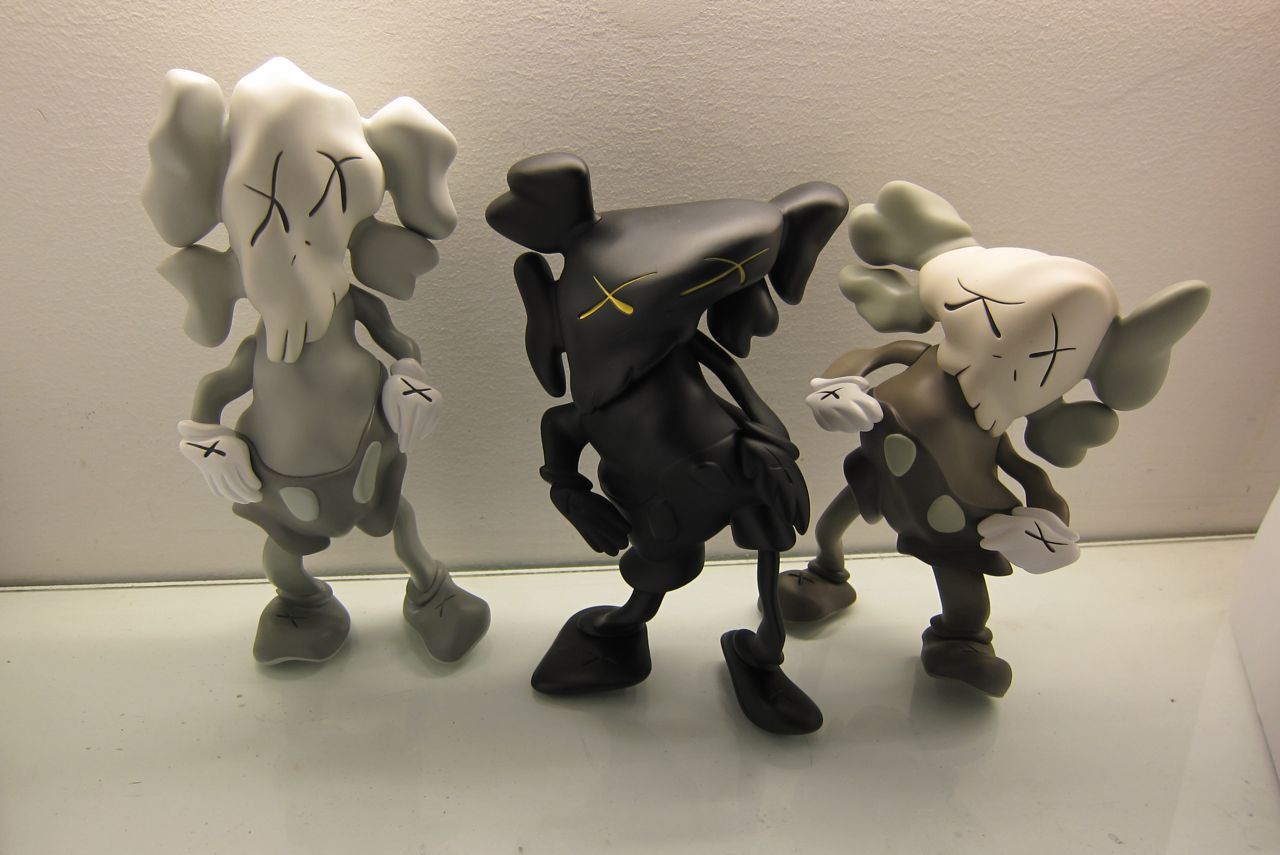 Details: KAWS x Robert Lazzarini – “Distorted Companions