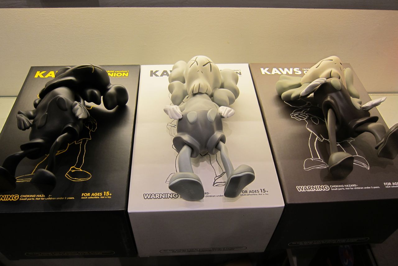 Details: KAWS x Robert Lazzarini – “Distorted Companions